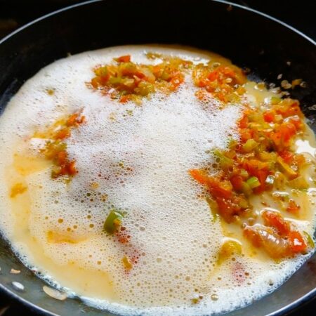 Pour in beaten eggs for anda bhurji masala