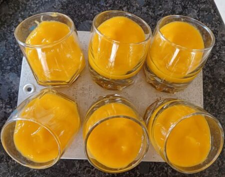 Pour mango mixture into glasses