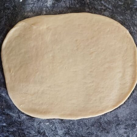 Roll out risen bread dough
