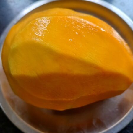 Wash and peel mango