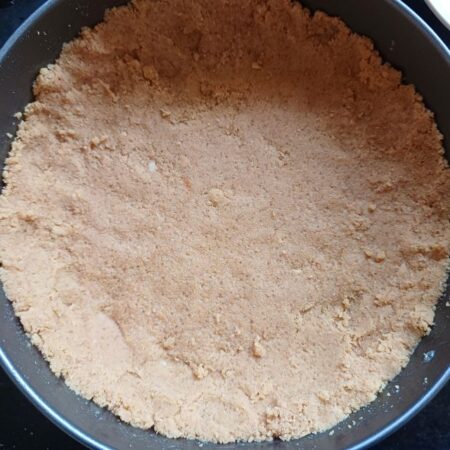 Press the biscuit mixture into the pan