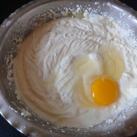 Add eggs to cheesecake batter