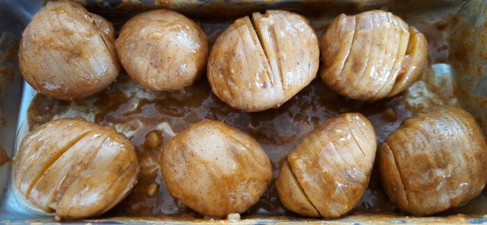 Brush sliced potatoes with butter garlic marinade