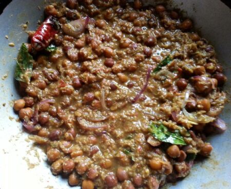 Pour tadka over the brown chickpeas kari