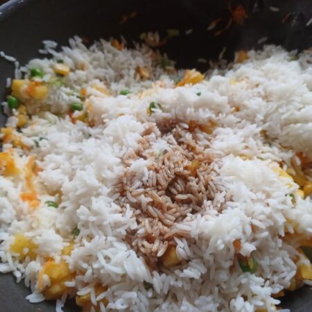 Pour soya sauce mixture over the rice