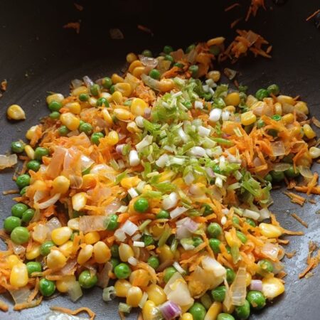 Saute spring onions for rice dish