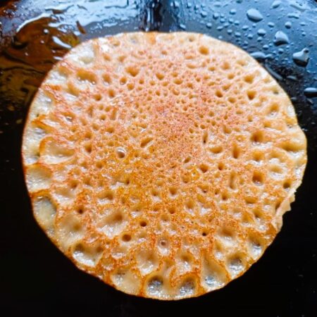 Once nicely browned, remove dosa onto a plate