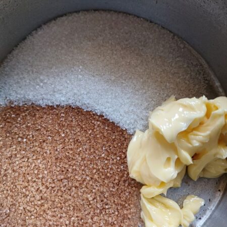 Mix butter, brown sugar and granulated sugar for apple dessert 