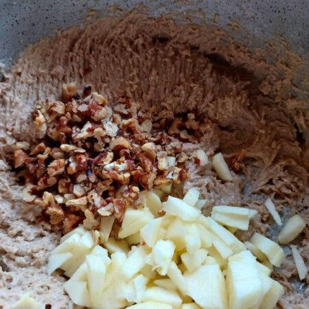 Add walnuts and diced apples to the cake batter