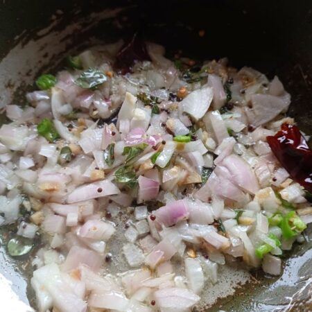 Fry onions for cassava stir fry