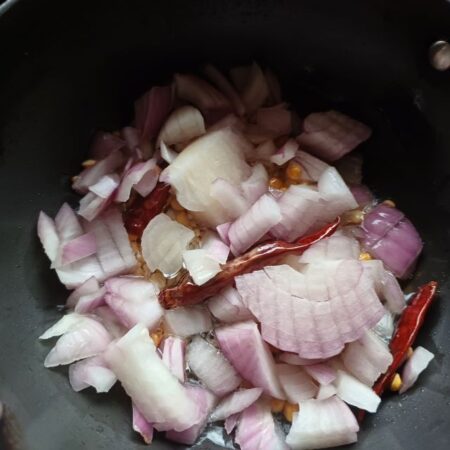 Chopped onions and curry leaves added for chutney recipe