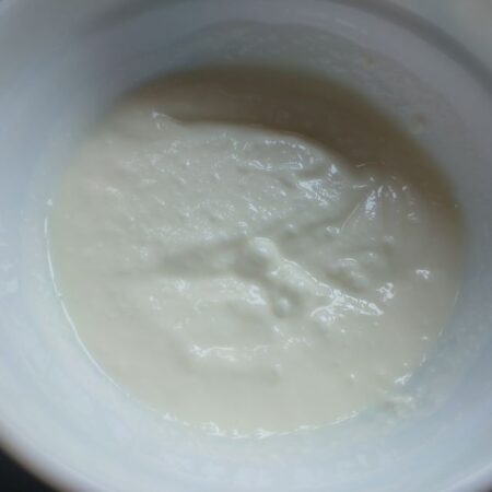 Whisk curd for brinjal raita recipe