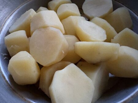 Boiled and peeled potatoes for pakora recipe