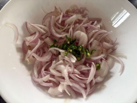 Sliced onions and green chillies for aachar recipe