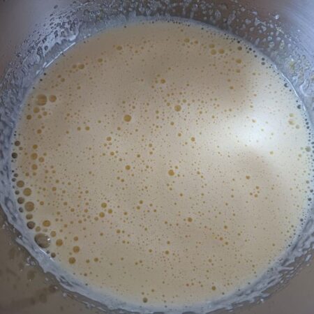 Beat sugar and eggs for Citrus Dessert