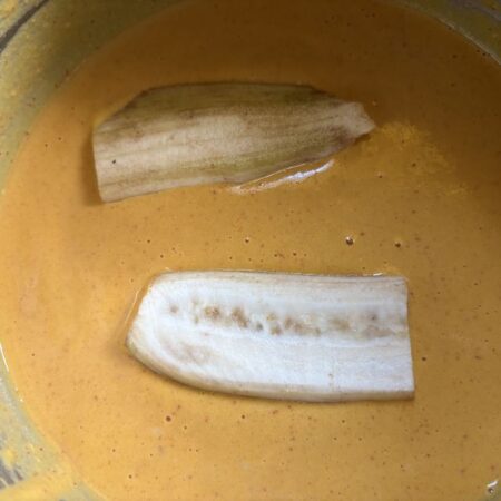 Coat plantain slices with bajji batter